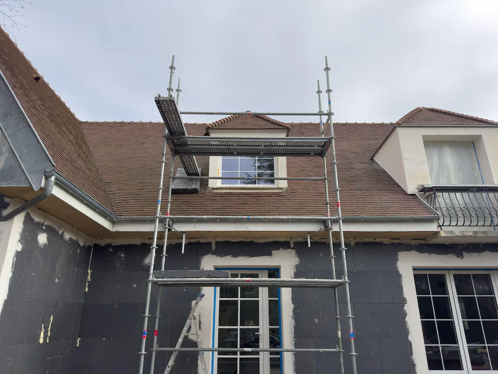 Scaffolding installed on house roof for repair and painting work in Downey CA by Downey Scaffolding Rental